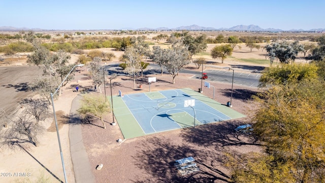 view of basketball court with a mountain view, a desert view, and community basketball court