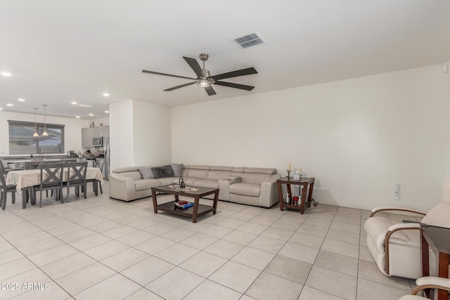 living room featuring light tile patterned floors, recessed lighting, visible vents, and ceiling fan