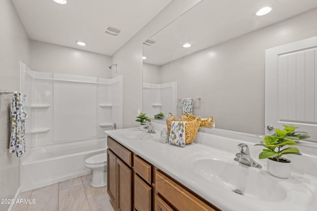 bathroom featuring double vanity, toilet, bathing tub / shower combination, recessed lighting, and tile patterned flooring
