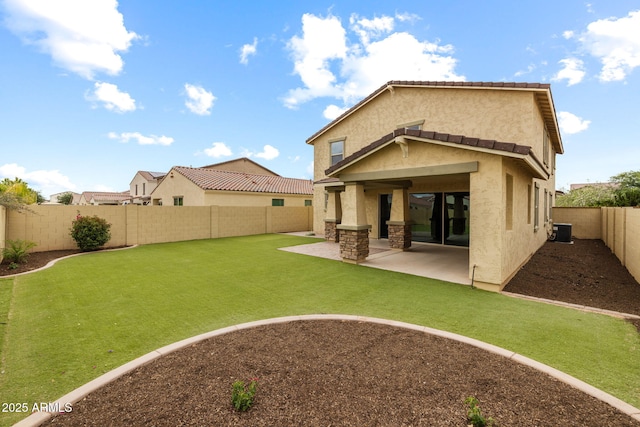 back of house featuring stucco siding and a patio area