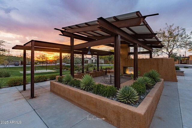 view of home's community featuring a pergola and a patio area