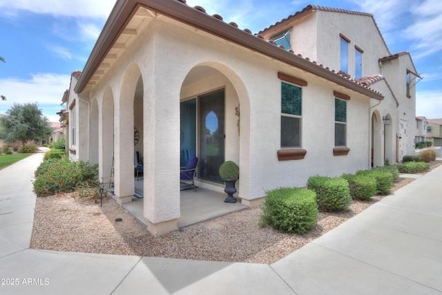 3855 S Mcqueen Rd Unit 12, Chandler, AZ 85286 - view of side of property with stucco siding and a tiled roof