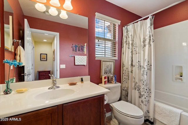 full bathroom featuring vanity, toilet, and shower / tub combo with curtain