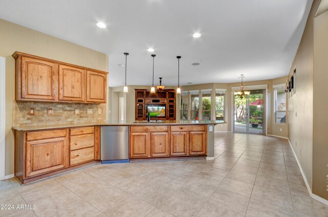 spare room with light colored carpet, a wealth of natural light, and ceiling fan