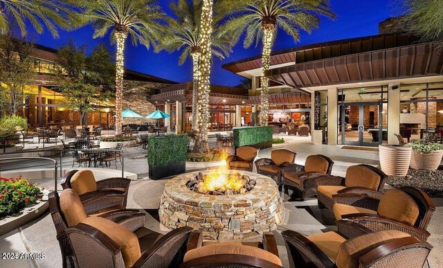 exterior space featuring an outdoor fire pit