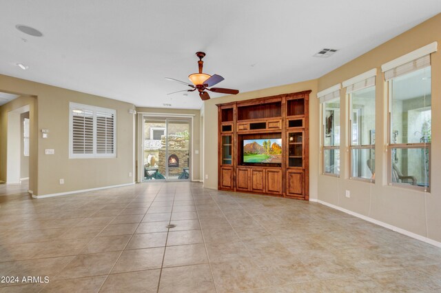 kitchen featuring appliances with stainless steel finishes, light tile patterned floors, sink, and decorative backsplash