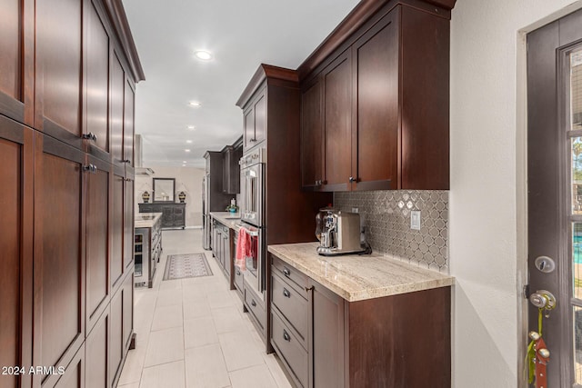 12423 N 64th St, Scottsdale, AZ 85254 - kitchen with decorative backsplash, light tile patterned floors, beverage cooler, recessed lighting, and appliances with stainless steel finishes