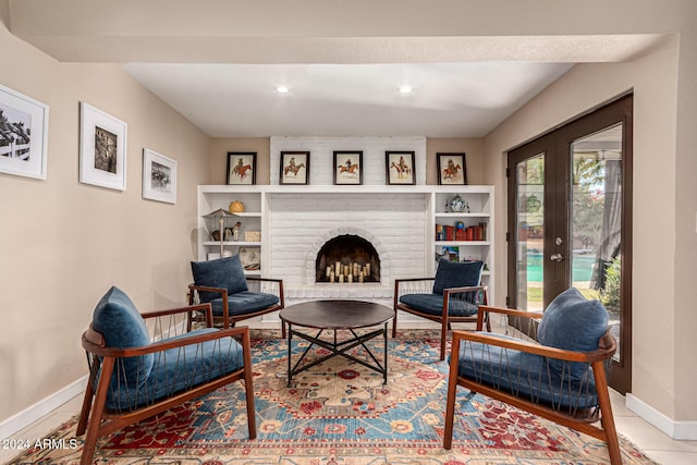 12423 N 64th St, Scottsdale, AZ 85254 - sitting room with baseboards, a fireplace, recessed lighting, and french doors