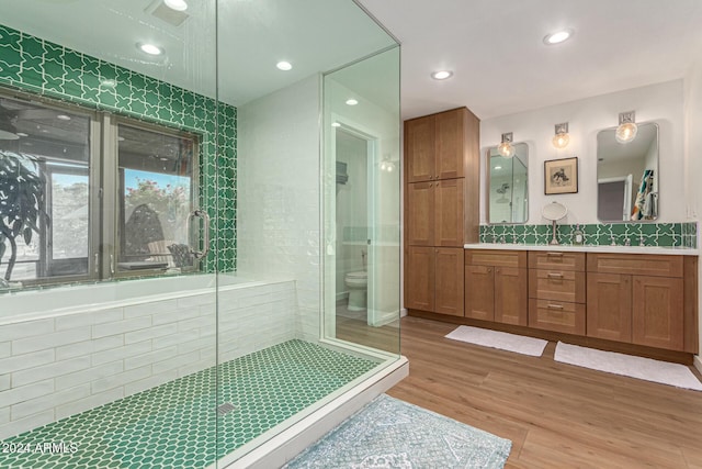 12423 N 64th St, Scottsdale, AZ 85254 - full bath featuring vanity, wood finished floors, toilet, recessed lighting, and a shower with shower door