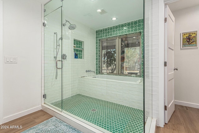 12423 N 64th St, Scottsdale, AZ 85254 - full bathroom with a stall shower, wood finished floors, a bath, and baseboards