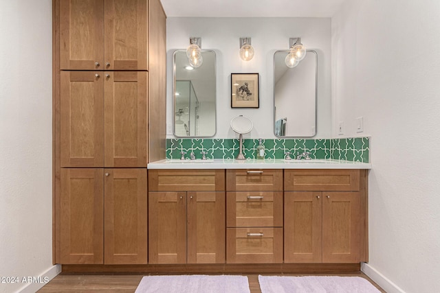 12423 N 64th St, Scottsdale, AZ 85254 - bathroom featuring baseboards, double vanity, and wood finished floors