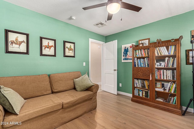 12423 N 64th St, Scottsdale, AZ 85254 - living room with a ceiling fan, light wood finished floors, and baseboards