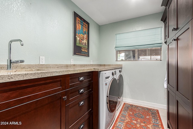 12423 N 64th St, Scottsdale, AZ 85254 - laundry room with washer and dryer, baseboards, tile patterned flooring, and cabinet space