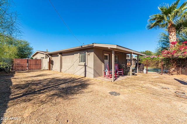 12423 N 64th St, Scottsdale, AZ 85254 - back of property with stucco siding and a patio