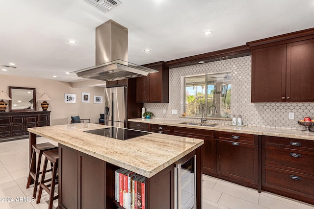 12423 N 64th St, Scottsdale, AZ 85254 - kitchen featuring island range hood, stainless steel fridge, a sink, beverage cooler, and backsplash