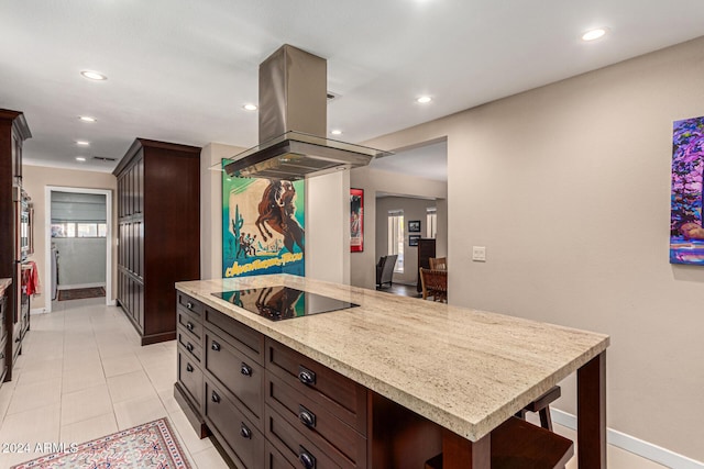 12423 N 64th St, Scottsdale, AZ 85254 - kitchen with black electric stovetop, baseboards, island range hood, dark brown cabinets, and recessed lighting