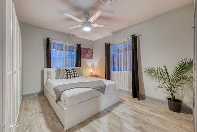 bedroom featuring light hardwood / wood-style flooring and ceiling fan