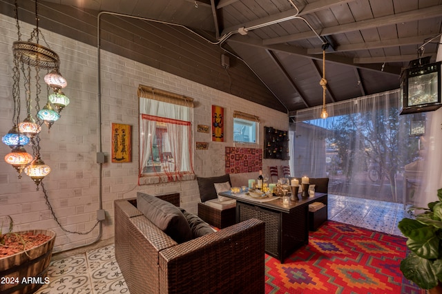 interior space with wood ceiling, high vaulted ceiling, and beamed ceiling