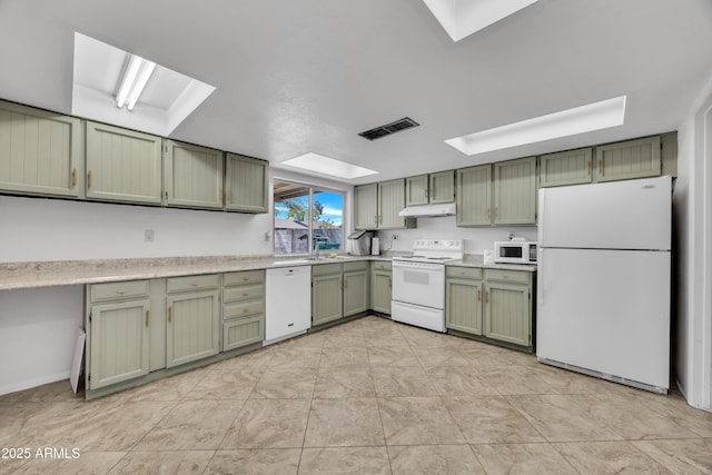 kitchen featuring visible vents, green cabinets, under cabinet range hood, light countertops, and white appliances