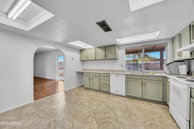 kitchen featuring green cabinets, white appliances, and visible vents