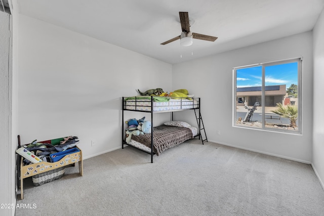 bedroom with baseboards, ceiling fan, and carpet flooring