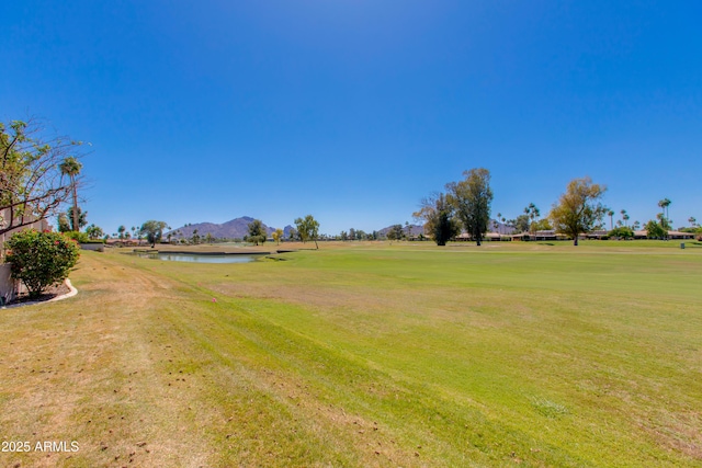 7810 E Via Camello Unit 72, Scottsdale, AZ 85258 - view of grassy yard with a water and mountain view and golf course view