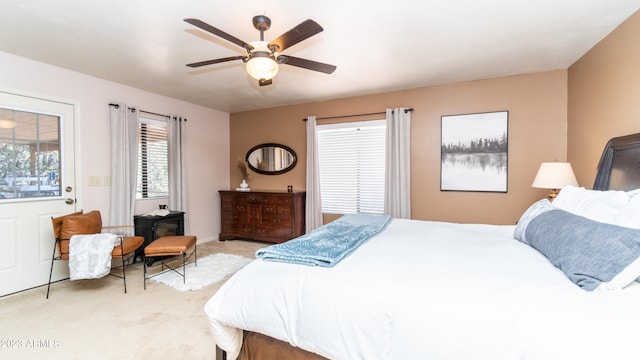 bedroom with light carpet and ceiling fan