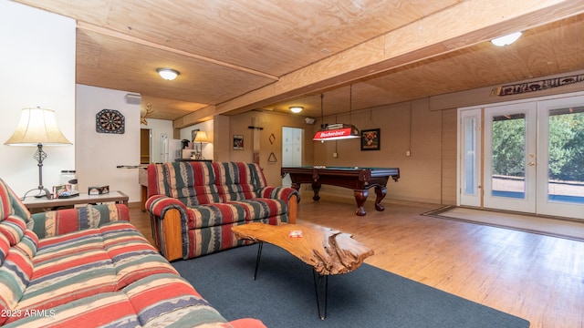 living room with pool table, wood ceiling, hardwood / wood-style flooring, beamed ceiling, and french doors