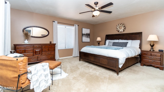 bedroom with ceiling fan and light colored carpet