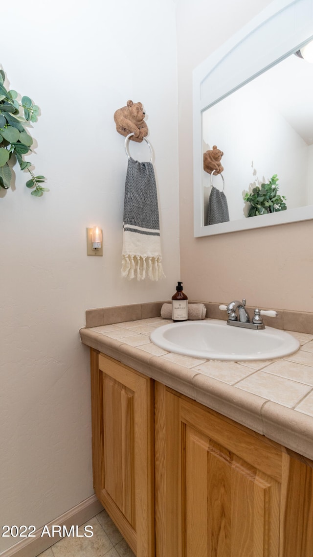 bathroom featuring vanity and tile patterned flooring