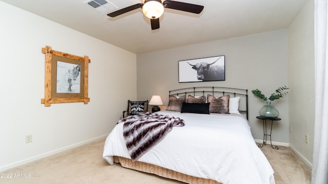 bedroom with light carpet and ceiling fan