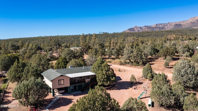 drone / aerial view featuring a mountain view