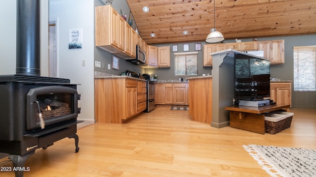 kitchen featuring hanging light fixtures, appliances with stainless steel finishes, wooden ceiling, light hardwood / wood-style floors, and a wood stove