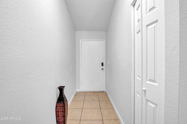 3027 E Grandview Rd Unit 1, Phoenix, AZ 85032 - hall with light tile patterned floors and a textured wall