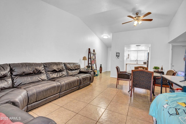 3027 E Grandview Rd Unit 1, Phoenix, AZ 85032 - living room featuring a ceiling fan, light tile patterned floors, and vaulted ceiling