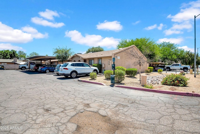 3027 E Grandview Rd Unit 1, Phoenix, AZ 85032 - view of front of property with covered and uncovered parking and stucco siding