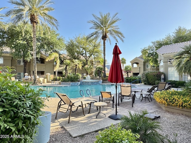 pool with a patio area