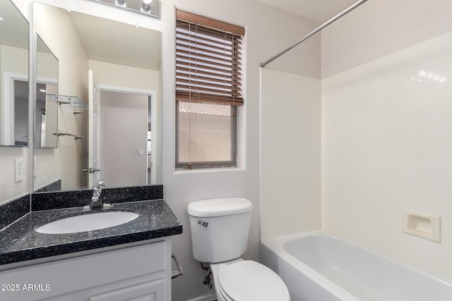 full bathroom featuring shower / bathtub combination, vanity, and toilet