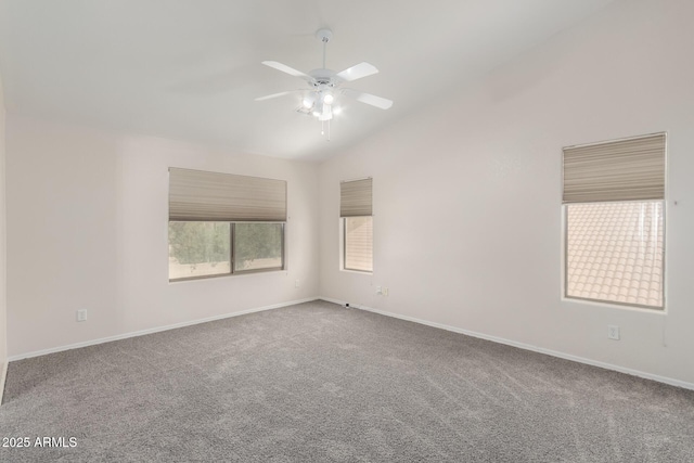 carpeted spare room with lofted ceiling and ceiling fan