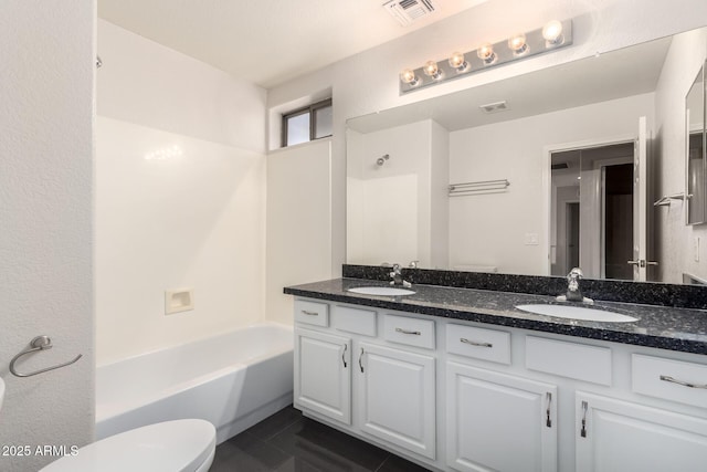 full bathroom featuring vanity, tile patterned flooring, toilet, and shower / bathing tub combination