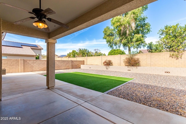 view of patio featuring ceiling fan