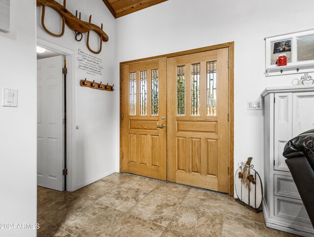 entrance foyer featuring lofted ceiling