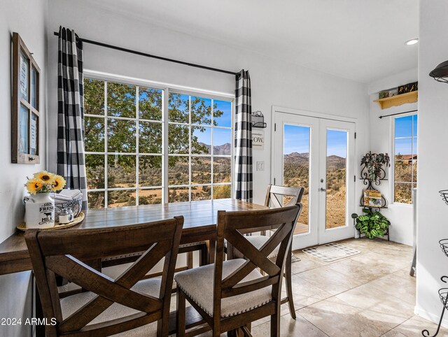 tiled dining room with french doors