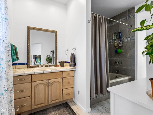 bathroom with shower / tub combo with curtain and vanity