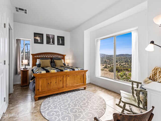 bedroom featuring light tile patterned floors