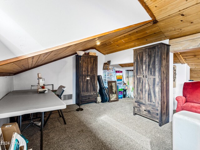 carpeted home office featuring vaulted ceiling and wooden ceiling