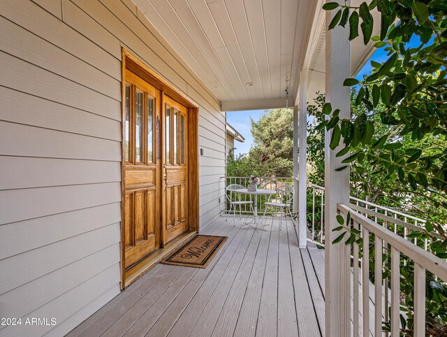 wooden deck featuring covered porch