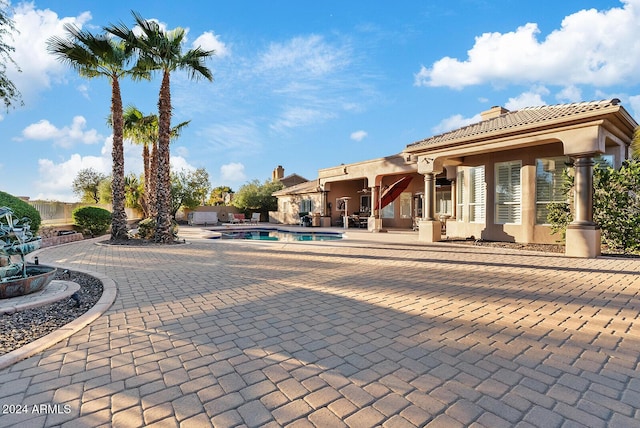 view of pool featuring a patio area