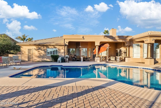 view of swimming pool featuring a patio