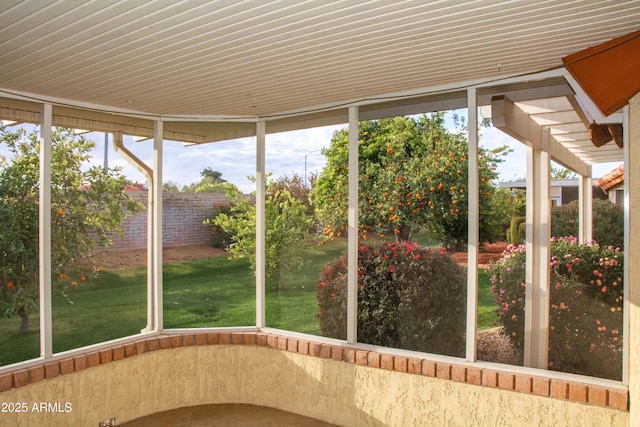 unfurnished sunroom with a wealth of natural light